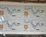 Plany czterech tras pieszych: E, F, H, K. Każda mapa pokazuje szlak wokół jeziora, dystans i czas trwania wycieczki jednodniowej.