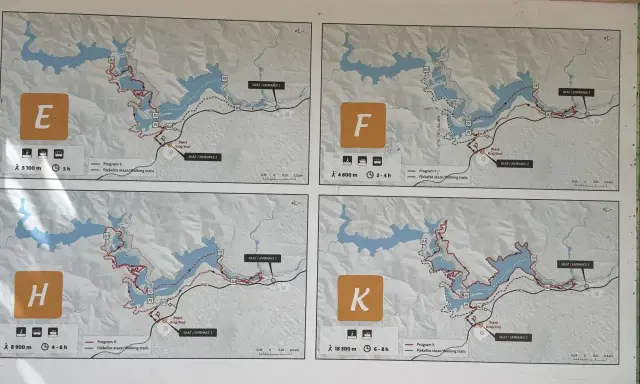 Plany czterech tras pieszych: E, F, H, K. Każda mapa pokazuje szlak wokół jeziora, dystans i czas trwania wycieczki jednodniowej.